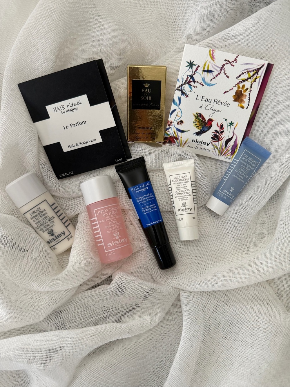 Sisley-Paris Skincare Selection in White, Pink, Blue & Gold Packaging